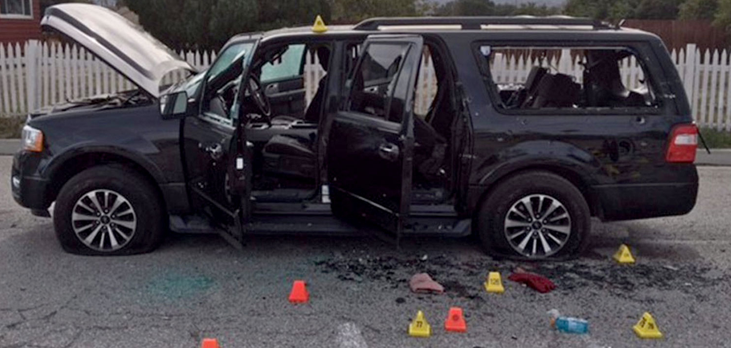 Black van with bullet holes